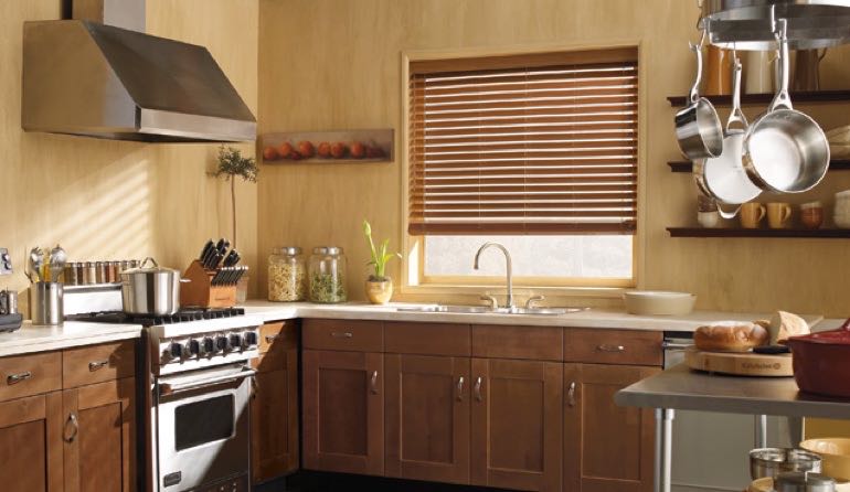 Clearwater kitchen faux wood blinds.